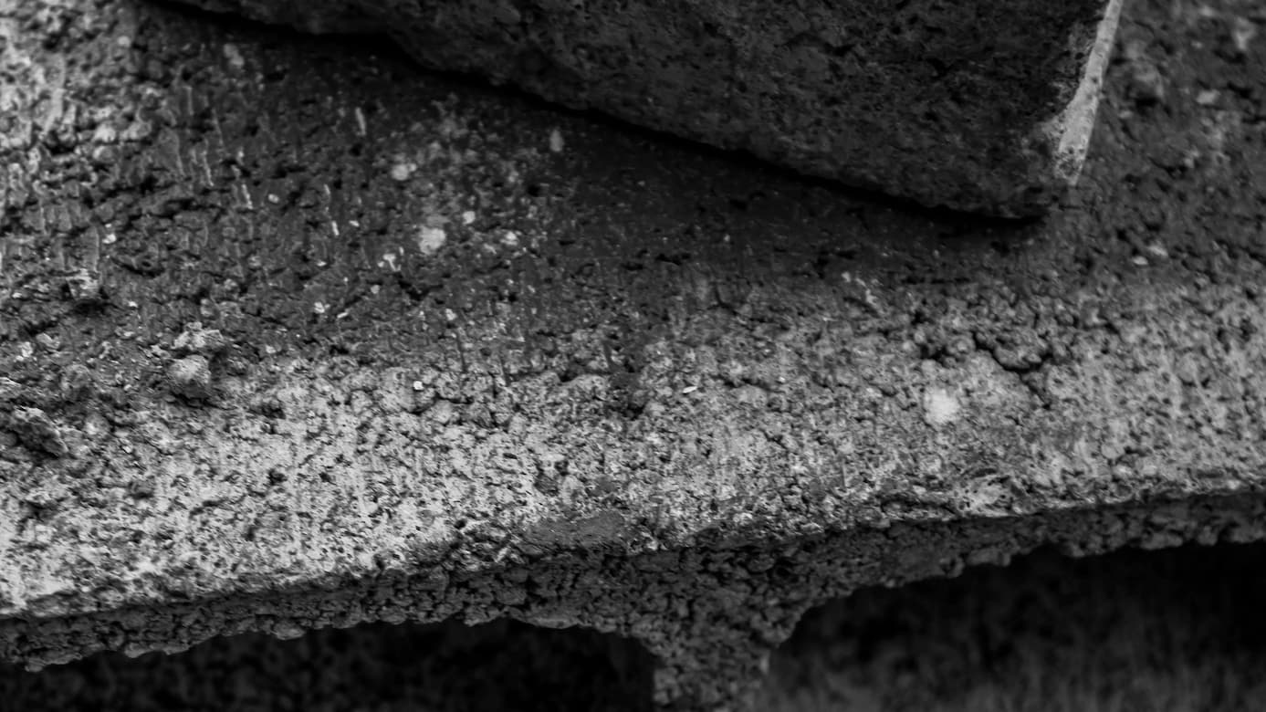 black dense concrete blocks stacked on each other