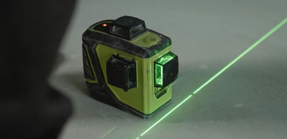 a laser level on top of floor levelling compound